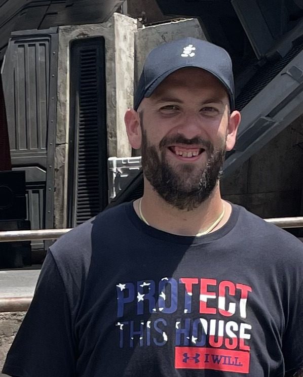 Sal today, smiling in a navy t-shirt and cap